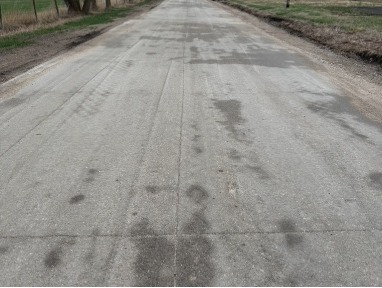 Municipal street surfaced with roller compacted concrete